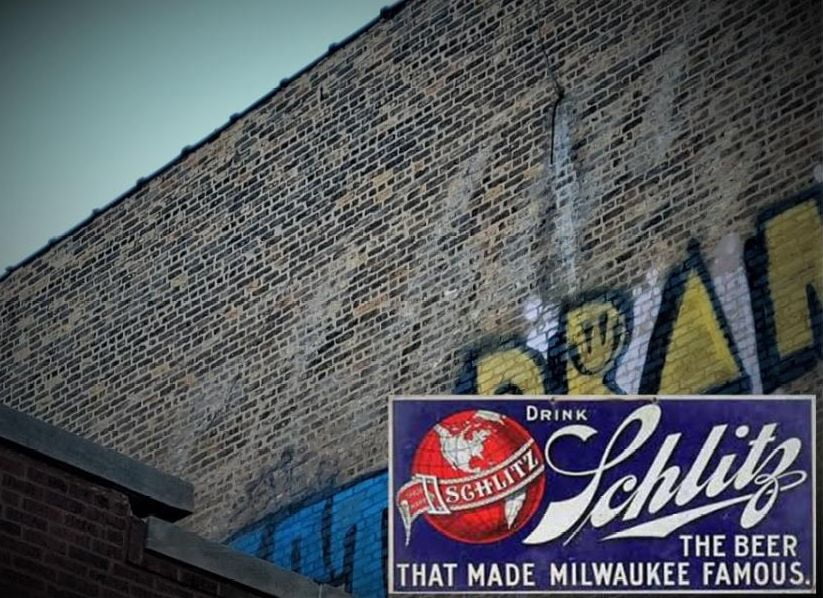Schlitz Logo Ghost Sign visible on the upper east brick wall of Lucé Building/ Schlitz Tied House, 1393-1399 W. Lake Street. Photo Credit: Ward Miller